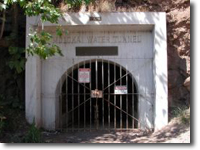 The entrance to the Molokai Water Tunnel. The Molokai Irrigation System is operated and managed by the State Department of Agriculture. Water is collected and pumped from Waikolu Valley, then transported through the tunnel to the Kualapuu Reservoir in Central Molokai.